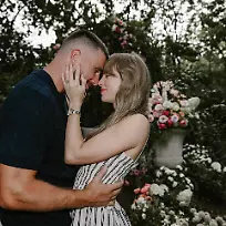 August-26-2025-Kansas-City-Missouri-USA-American-Grammy-winning-singer-songwriter-actress-and-billionaire-TAYLOR-ALISON-SWIFT-35-looking-into-eyes-of-her-fiance-TRAVIS-MICHAEL-KELCE-35-They-announced-their-engagement-on-Instagram-Tuesday-sharing-photos-of-their-garden-proposal-at-flower-adorned-gazebo-at-Kelce-s-home-in-Missouri-Your-English-teacher-and-your-gym-teacher-are-getting-married-the-pair-wrote-on-their-social-media-post-Kelce-is-an-American-professional-football-player-who-is-a-tight-end-for-the-NFL-s-Kansas-City-Chiefs-of-the-National-Football-League-Selected-by-the-Chiefs-in-the-third-round-of-the-2013-NFL-draft-and-later-won-Super-Bowls-LIV-LVII-and-LVIII-with-the-team