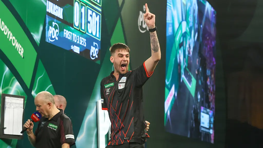 14-12-2025-2025-26-World-Darts-Championship-Dom-Taylor-hits-a-double-and-celebrates-during-the-2025-26-Paddy-Power-World-Darts-Championships-at-Alexandra-Palace-London-United-Kingdom-on-14-December-2025