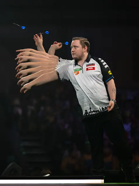28th-December-2025-Alexandra-Palace-London-England-2025-PDC-Paddy-Power-World-Darts-Championship-Day-Fifteen-Multiple-exposure-of-Martin-Schindler-in-action-on-the-oche-in-his-third-round-match-against-Ryan-Searle