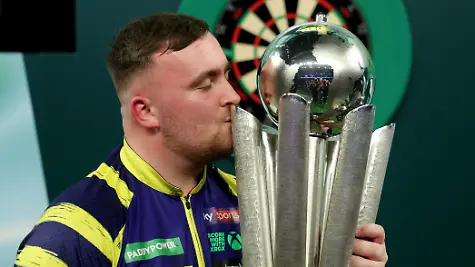Darts-World-Darts-Championship-Alexandra-Palace-London-Britain-January-3-2026-Luke-Littler-celebrates-with-the-trophy-after-winning-the-World-Darts-Championship-Action-Images-via-Reuters-Paul-Childs