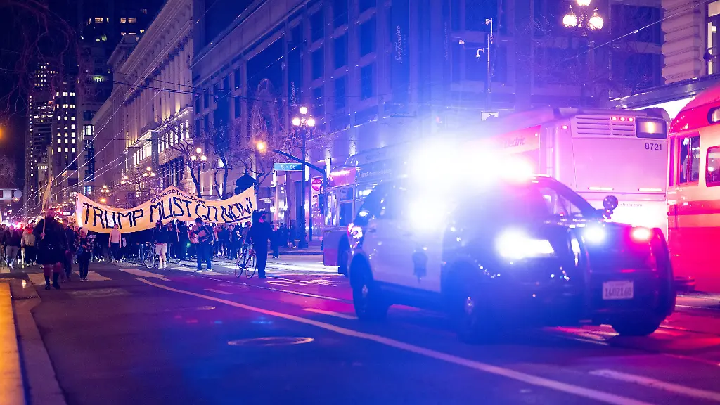 January-7-2026-San-Francisco-California-USA-A-San-Francisco-Police-cruiser-escorts-a-rally-and-march-against-the-Immigration-and-Customs-Enforcement-ICE-killing-of-U-S-citizen-Renee-Nicole-Good-in-San-Francisco-on-Wednesday-Jan-7-2026-An-officer-shot-and-killed-Good-during-an-immigration-enforcement-action