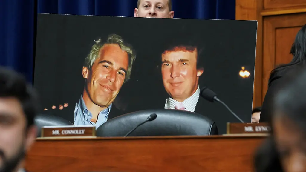 Rep-Jared-Moskowitz-D-FL-holds-up-a-photo-of-former-U-S-President-Donald-Trump-with-late-sex-offender-Jeffrey-Epstein-during-a-meeting-of-the-the-House-Oversight-and-Accountability-Committee-to-markup-a-resolution-and-report-to-hold-Hunter-Biden-President-Joe-Biden-s-son-in-contempt-of-Congress-after-he-refused-to-appear-for-a-closed-door-deposition-at-the-Capitol-in-Washington-U-S-January-10-2024