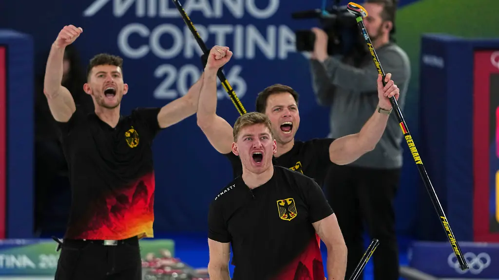 Germany-s-Johannes-Scheuerl-Marc-Muskatewitz-and-Benjamin-Kapp-react-after-the-men-s-curling-round-robin-session-against-Italy-at-the-2026-Winter-Olympics-in-Cortina-d-Ampezzo-Italy-Friday-Feb-13-2026