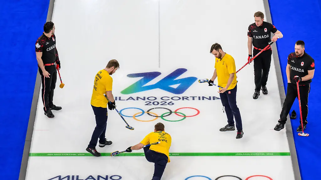 260213-Marc-Kennedy-Ben-Hebert-and-Brett-Gallant-of-Canada-and-Rasmus-Wrana-Christoffer-Sundgren-and-Oskar-Eriksson-of-Sweden-compete-in-a-men-s-round-robin-curling-match-between-Canada-and-Sweden-during-day-7-of-the-2026-Winter-Olympics-on-February-13-2026-in-Cortina