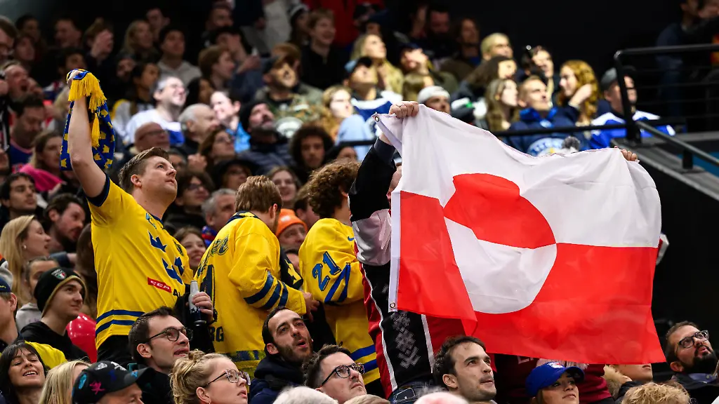 260214-A-flag-of-Greenland-in-the-stands-during-the-men-s-ice-hockey-game-between-USA-and-Denmark-during-day-8-of-the-2026-Winter-Olympics-on-February-14-2026-in-Milan