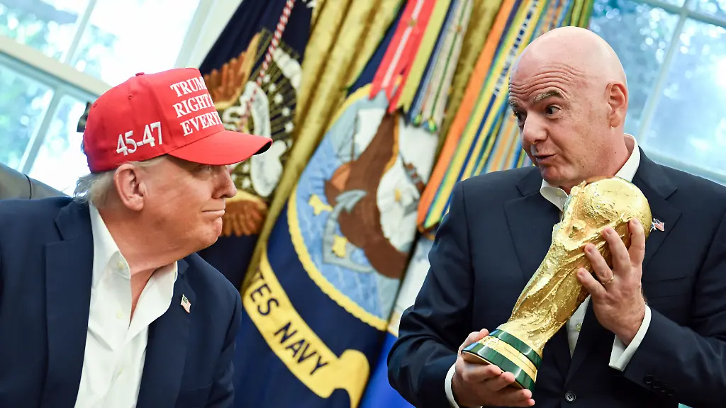 Gianni-Infantino-President-Federation-Internationale-de-Football-Association-FIFA-hands-United-States-President-Donald-J-Trump-the-FIFA-World-Cup-trophy-after-announcing-the-2026-World-Cup-draw-will-be-held-at-the-Kennedy-Center-in-December-in-the-Oval-Office-of-the-White-House-in-Washington-DC-on-Friday-August-22-2025-The-FIFA-World-Cup-coming-to-North-America-next-summer-will-be-the-first-World-Cup-with-three-host-countries-in-the-U-S-Canada-and-Mexico-and-it-will-be-the-first-to-feature-a-48-team-field