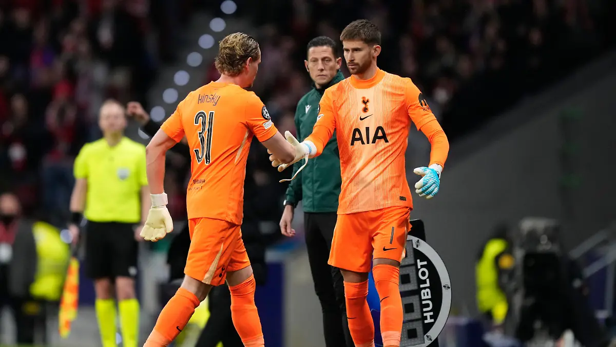 Tottenham-s-goalkeeper-Antonin-Kinsky-left-shakes-hands-with-Tottenham-s-goalkeeper-Guglielmo-Vicario-after-substitution-during-the-first-leg-of-the-Champions-League-round-of-16-soccer-match-between-Atletico-Madrid-and-Tottenham-in-Madrid-Spain-Tuesday-March-10-2026