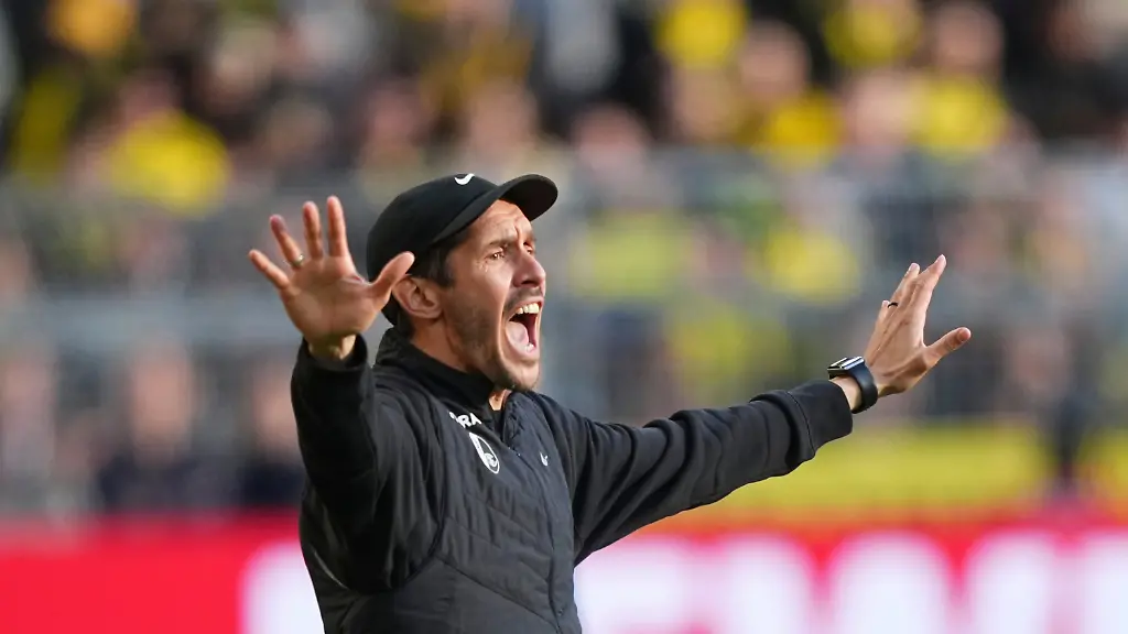 Freiburg-s-head-coach-Julian-Schuster-reacts-during-the-German-Bundesliga-soccer-match-between-Borussia-Dortmund-and-SC-Freiburg-in-Dortmund-Germany-Sunday-April-26-2026