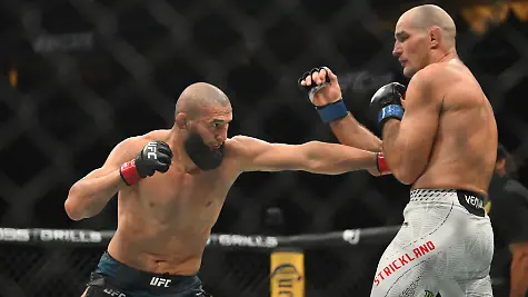 May-9-2026-Newark-New-Jersey-UNITED-STATES-Khamzat-Chimaev-red-gloves-fights-Sean-Strickland-blue-gloves-during-UFC-328-at-Prudential-Center