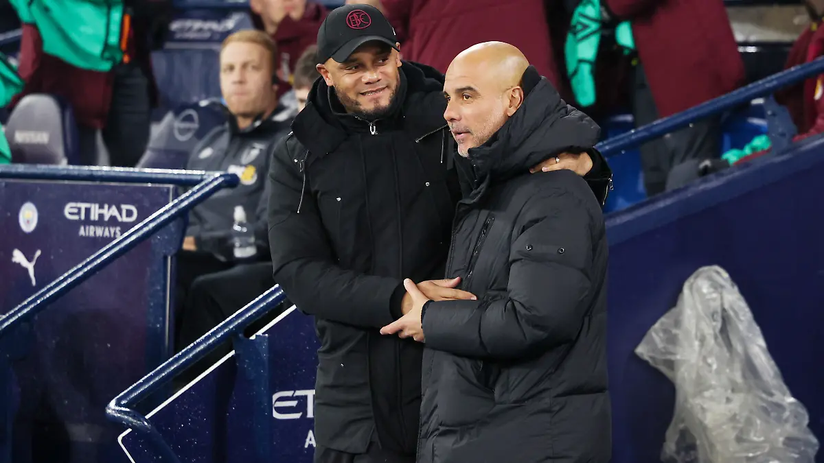 Burnley-Manager-Vincent-Kompany-and-Manchester-City-Manager-Pep-Guardiola-during-the-English-championship-Premier-League-football-match-between-Manchester-City-and-Burnley-on-31-January-2024-at-the-Etihad-Stadium-in-Manchester-England-Photo-Simon-Davies-ProSportsImages-DPPI