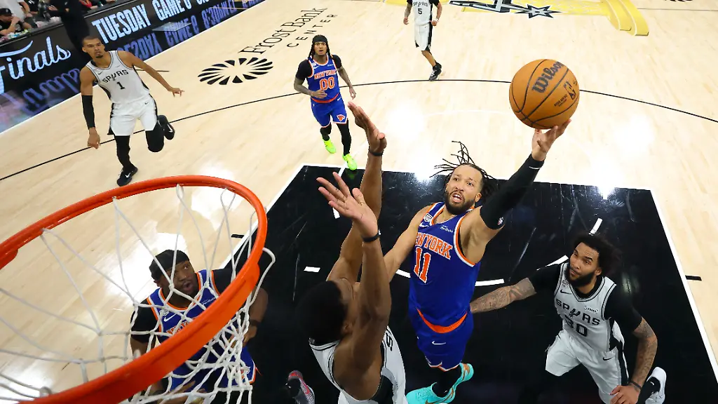 Jun-13-2026-San-Antonio-Texas-USA-New-York-Knicks-guard-Jalen-Brunson-11-drives-to-the-basket-past-San-Antonio-Spurs-forward-Julian-Champagnie-30-during-game-five-of-the-2026-NBA-Finals-at-Frost-Bank-Center
