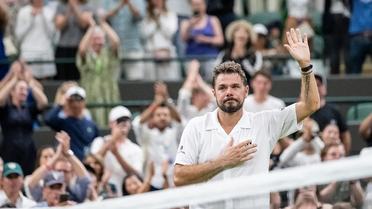 Stan-Wawrinka-of-Switzerland-bids-farewell-to-the-spectators-after-losing-his-first-round-match-against-Matteo-Berrettini-of-Italy-at-the-Wimbledon-All-England-Lawn-Tennis-Championships-AELTC-in-London-on-Tuesday-June-30-2026-It-was-Wawrinka-s-last-appearance-in-Wimbledon-as-he-is-retiring-from-professional-tennis-at-the-end-of-the-year