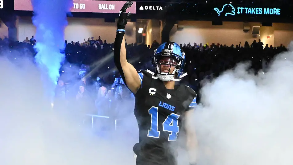 DETROIT-MI-DECEMBER-15-Detroit-Lions-wide-receiver-Amon-Ra-St-Brown-14-is-introduced-during-pregame-ceremonies-prior-to-the-Detroit-Lions-versus-the-Buffalo-Bills-game-on-Sunday-December-15-2024-at-Ford-Field-in-Detroit-MI