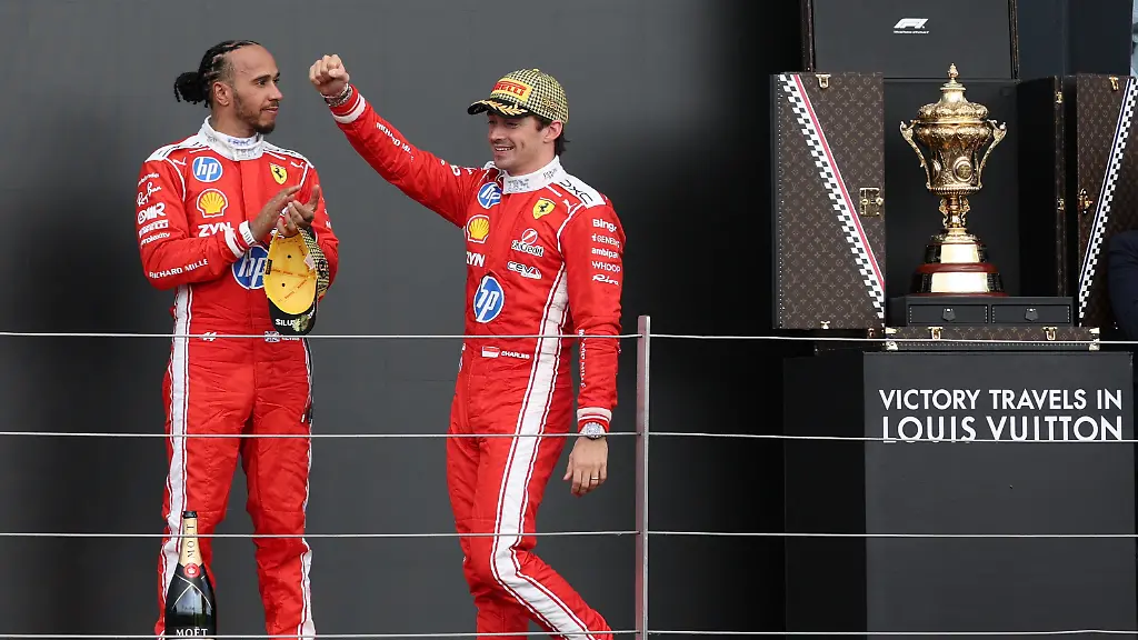 Formula-One-F1-British-Grand-Prix-Silverstone-Circuit-Silverstone-Britain-July-5-2026-Ferrari-s-Charles-Leclerc-celebrates-on-the-podium-after-winning-the-British-Grand-Prix-with-Ferrari-s-Lewis-Hamilton-who-finished-in-third-place-REUTERS-Andrew-Boyers
