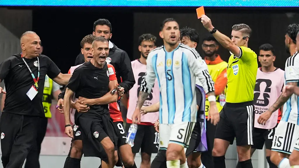 Referee-Francois-Letexier-of-France-shows-a-red-card-to-Egypt-assistant-coach-Mohamed-Abdel-Wahed-during-the-World-Cup-round-of-16-soccer-match-between-Argentina-and-Egypt-in-Atlanta-Tuesday-July-7-2026