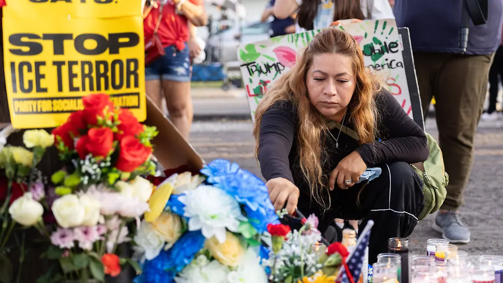 July-8-2026-Houston-Texas-USA-A-woman-visits-a-memorial-for-Lorenzo-Salgado-Araujo-during-a-protest-against-U-S-Immigration-and-Customs-Enforcement-ICE-in-Houston-s-Magnolia-Park-neighborhood-on-Wednesday-The-demonstration-followed-the-fatal-shooting-of-Salgado-Araujo-by-an-ICE-agent-during-an-attempted-immigration-enforcement-operation-an-incident-that-has-prompted-calls-from-community-leaders-and-elected-officials-for-an-independent-investigation