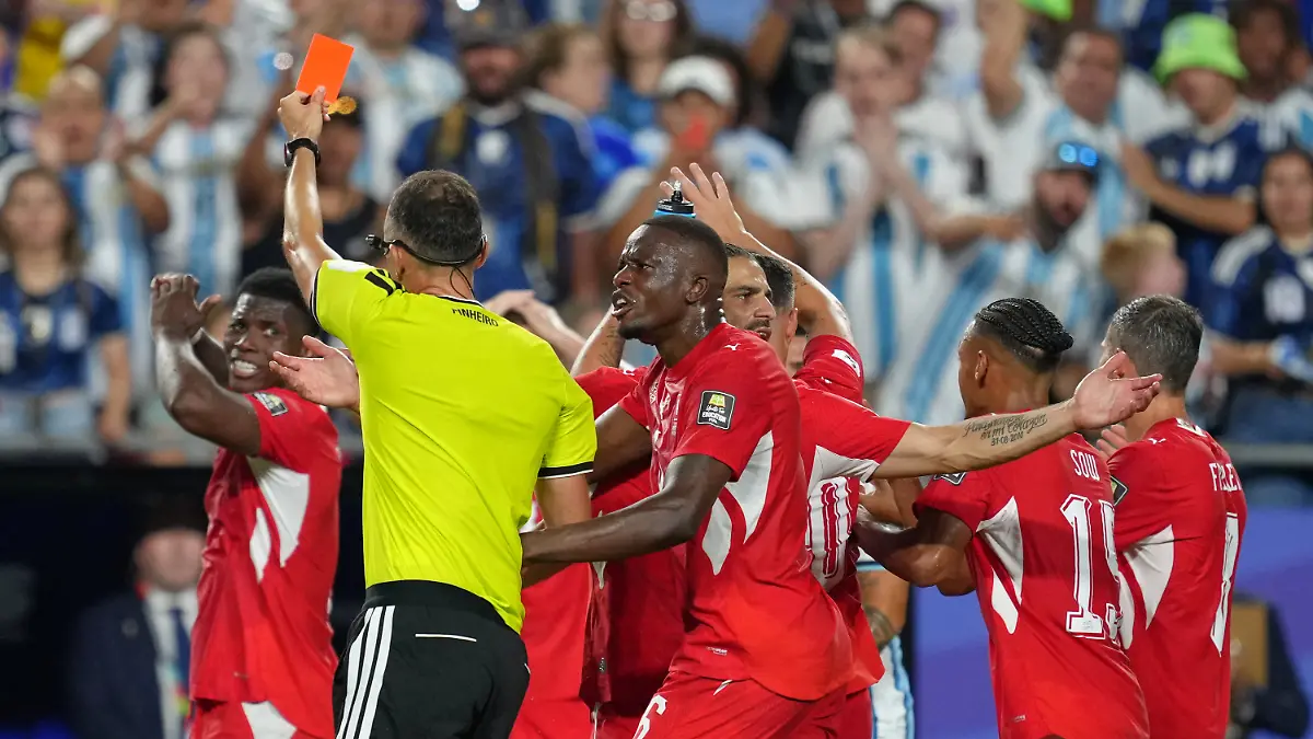 Referee-Joao-Pinheiro-of-Portugal-gives-a-red-card-to-Switzerland-s-Breel-Embolo-7-left-during-the-World-Cup-quarterfinal-soccer-match-between-Argentina-and-Switzerland-in-Kansas-City-Mo-Saturday-July-11-2026