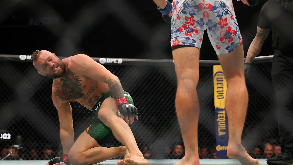 Jul-11-2026-Las-Vegas-Nevada-USA-Conor-McGregor-left-attempts-to-get-up-after-falling-against-Max-Holloway-during-UFC-329-at-T-Mobile-Arena-Mandatory-Credit-Mark-J