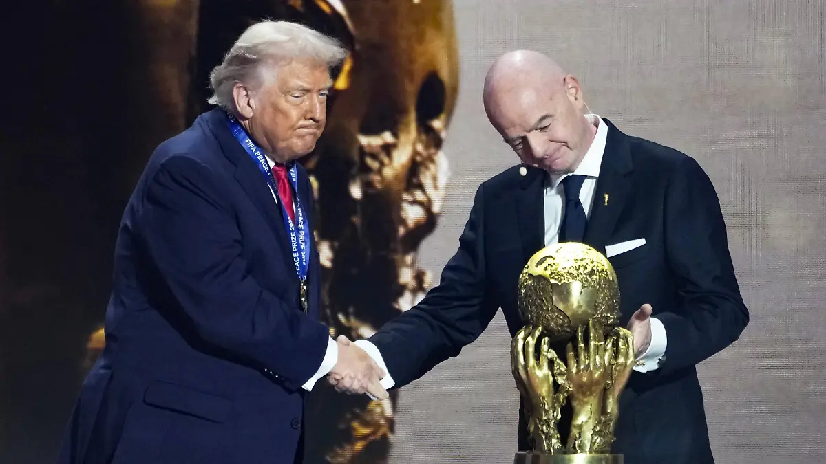 Football-World-Cup-draw-U-S-President-Donald-Trump-L-shakes-hands-with-FIFA-President-Gianni-Infantino-as-the-newly-established-FIFA-Peace-Prize-is-given-to-him-during-the-2026-World-Cup-official-draw-in-Washington-on-Dec-5-2025