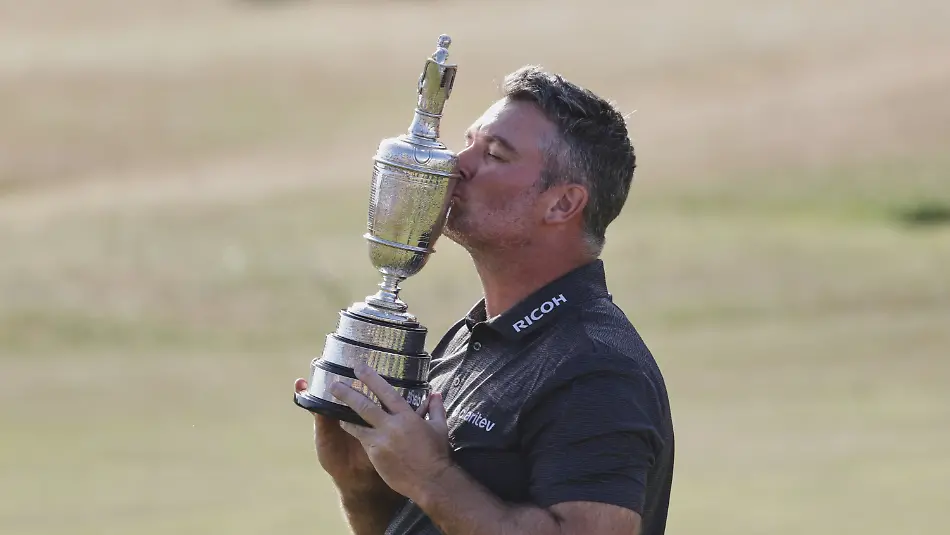 Ryan-Fox-of-New-Zealand-kisses-the-trophy-as-he-poses-for-the-media-with-the-Claret-Jug-trophy-after-winning-the-British-Open-Golf-championships-at-Royal-Birkdale-golf-club-in-Southport-England-Sunday-July-19-2026