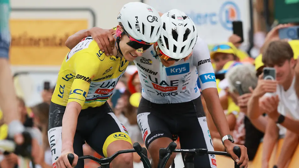 Cycling-Tour-de-France-Stage-20-Le-Bourg-d-Oisans-to-Alpe-d-Huez-Alpe-d-Huez-France-July-25-2026-UAE-Team-Emirates-XRG-s-Tadej-Pogacar-wearing-the-yellow-jersey-and-UAE-Team-Emirates-XRG-s-Isaac-Del-Toro-wearing-the-white-jersey-celebrate-at-the-end-of-stage-20-REUTERS-Stephanie-Lecocq