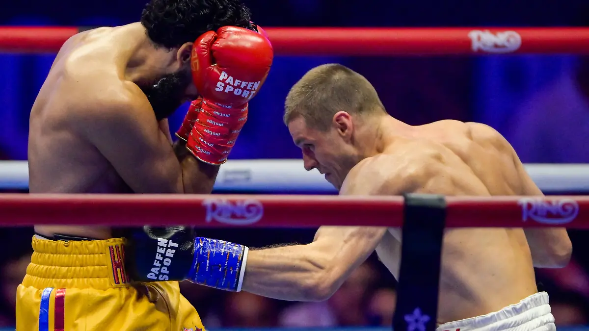 JEDDAH-SAUDI-ARABIA-JULY-25-Simon-Zachenhuber-white-and-red-shorts-punches-Hamzah-Sheeraz-yellow-and-red-shorts-during-the-WBO-World-Super-Middleweight-title-fight-between-Hamzah-Sheeraz-and-Simon-Zachenhuber-in-the-Anthony-Joshua-v-Kristian-Prenga-The-Comeback-fight-night-at-Jeddah-Superdome-on-July-25-2026-in-Jeddah-Saudi-Arabia