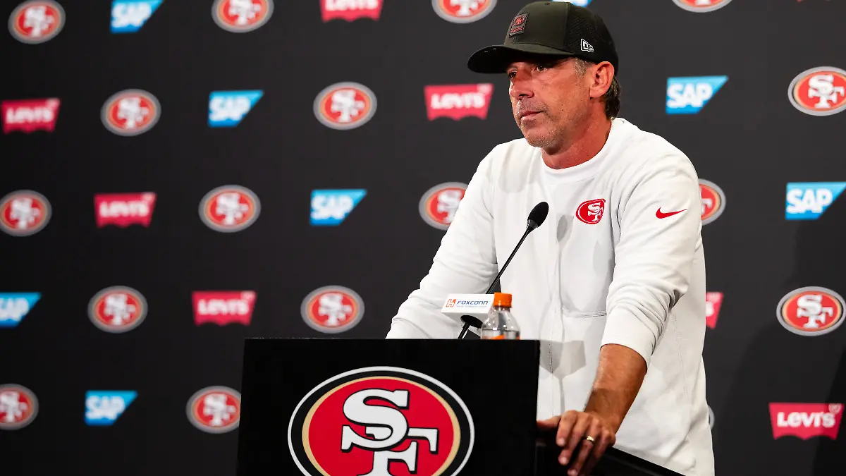 SANTA-CLARA-CA-AUGUST-04-San-Francisco-49ers-Head-Coach-Kyle-Shanahan-speaks-to-the-media-during-San-Francisco-49ers-Training-Camp-on-August-4-2025-at-the-SAP-Performance-Facility-in-Santa-Clara-CA